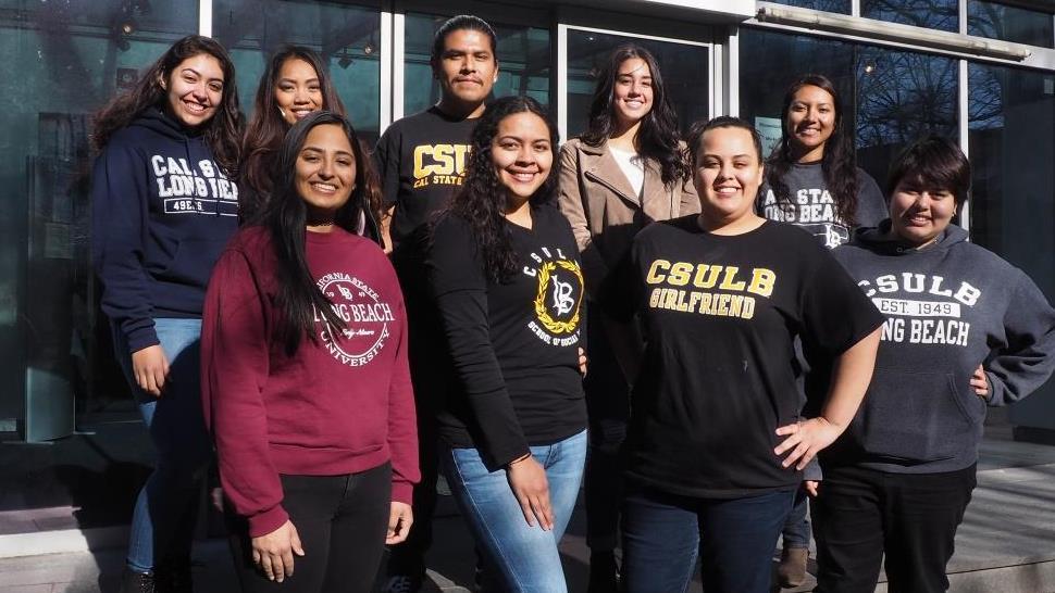 Group of female students smiling into the camera