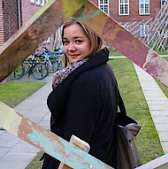 Female student standing on campus 