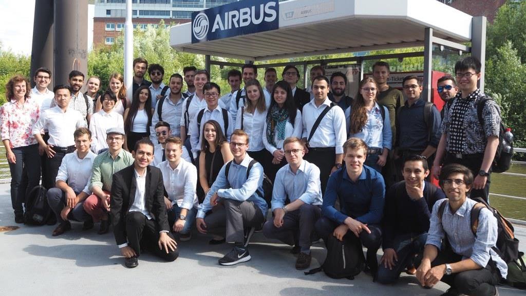 group of students in front of Airbus logo