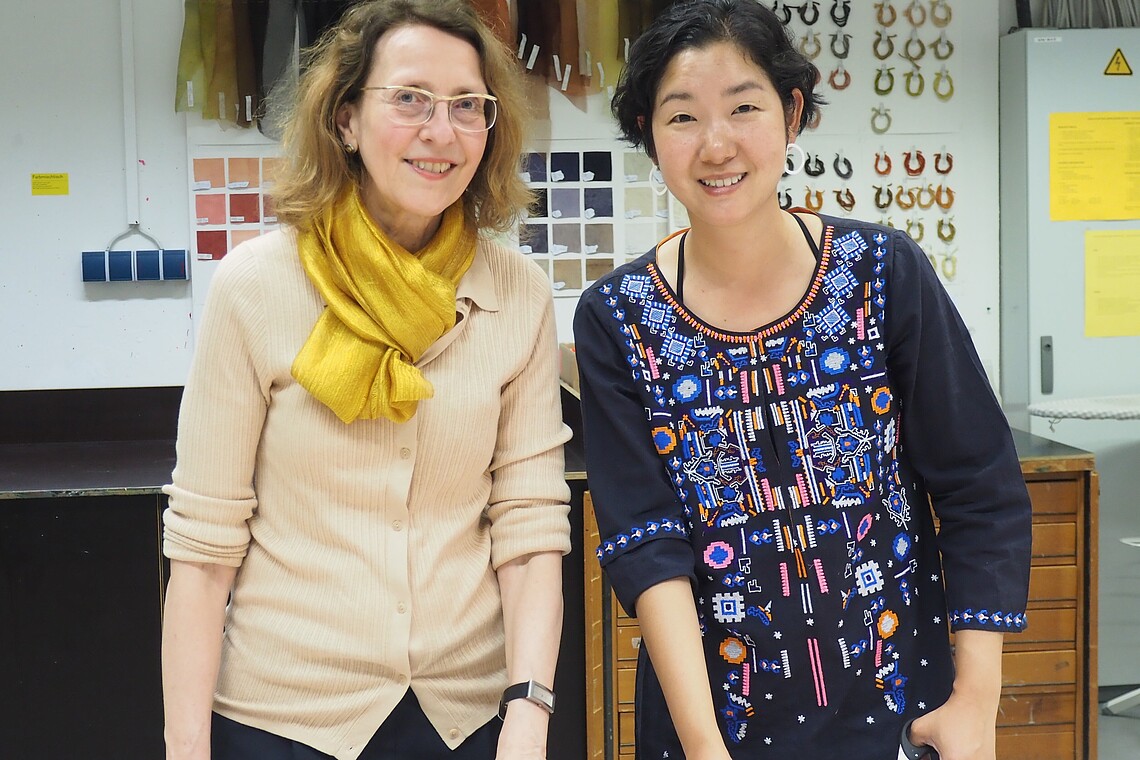 Two female professors looking into the camera