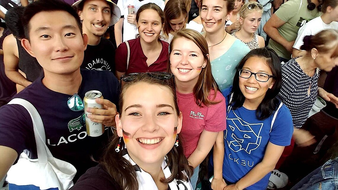 Group of students smiling into the camera