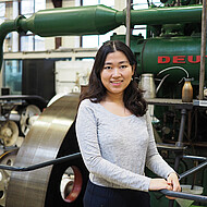 Female student in a machine hall