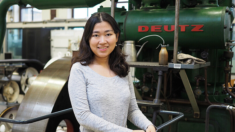 Female student in a machine hall