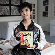 Female student holding a book