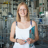 Female student standing in a chemistry lab