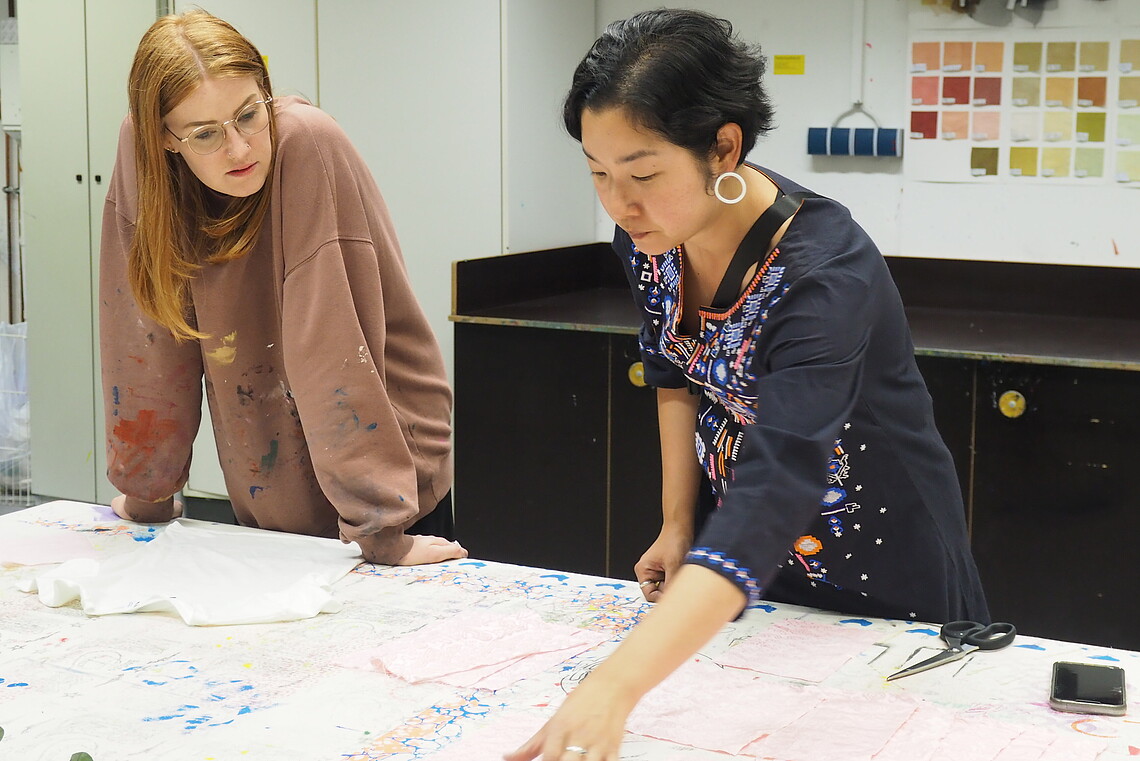 Two people in a textile design lab