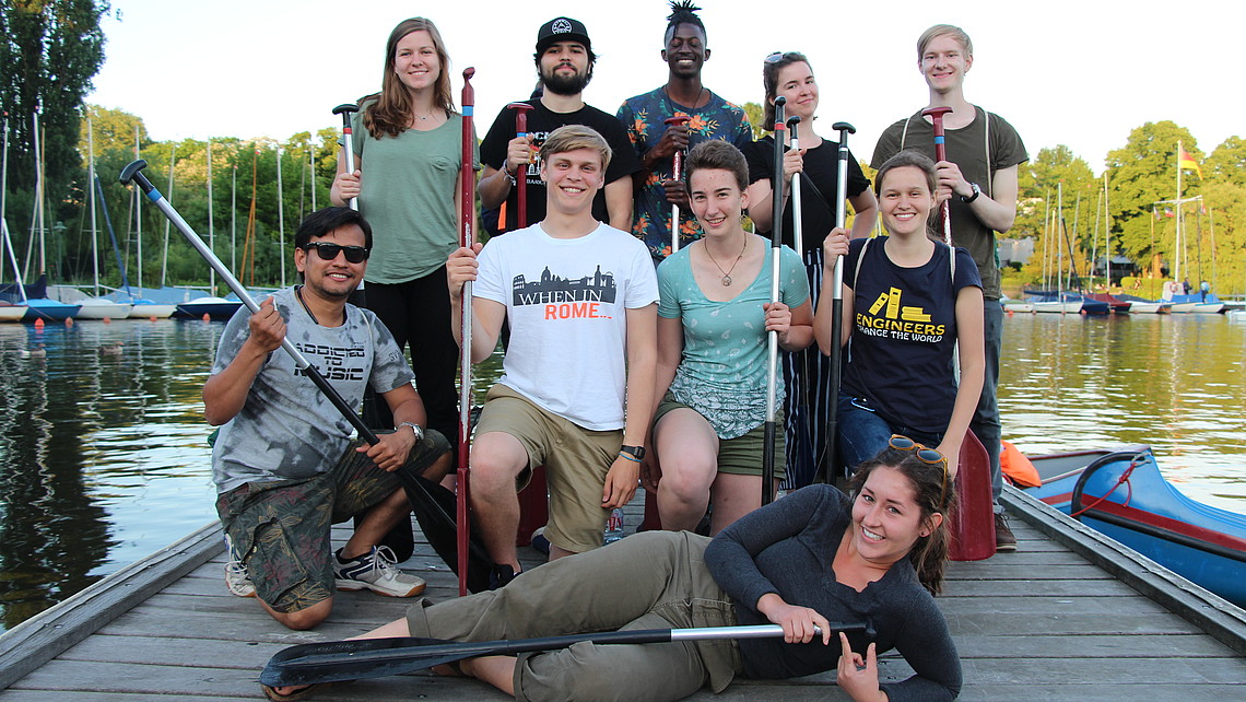 Group of students with canoe oars