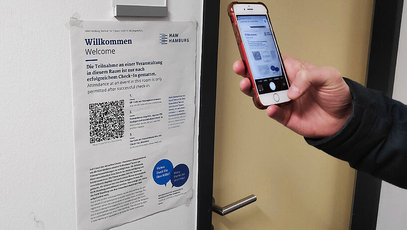 A QR code is scanned with a smartphone.
