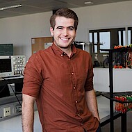 Male student sitting in computer lab