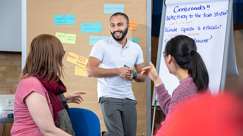 Student laughing in a workshop for foreign languages