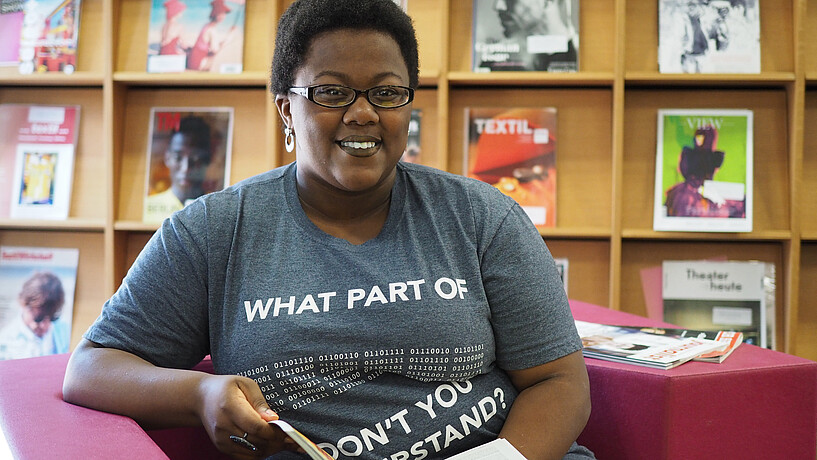 Female student sitting in library