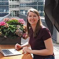 Erika Bryant - exchange student Female student sitting with a laptop outside on campus